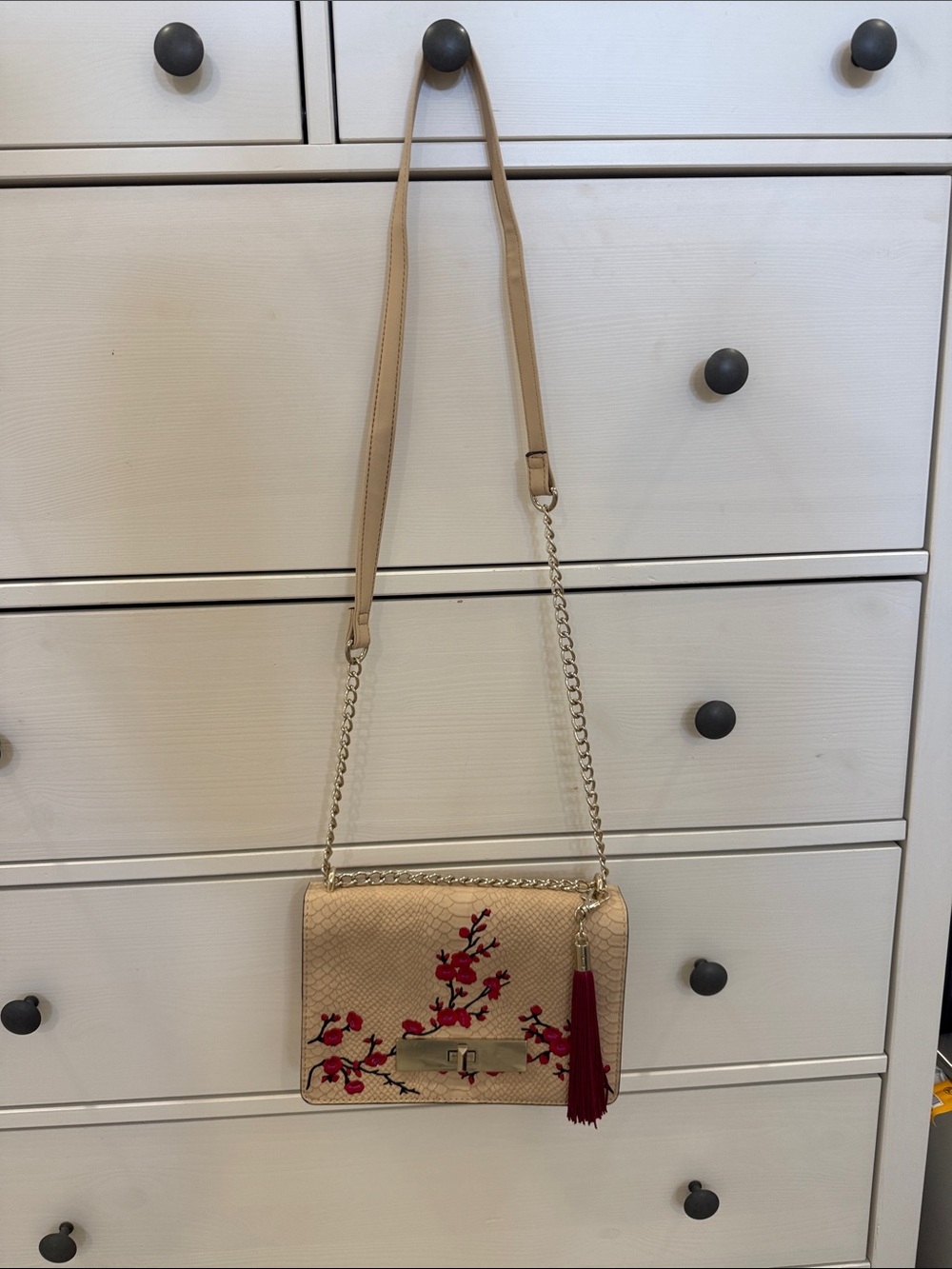 Beige Embroidered Crossbody Bag with Red Tassel Accent